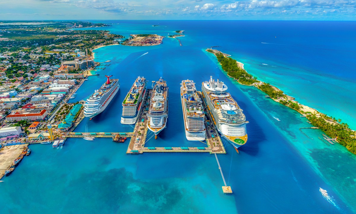 Cruise ships beside bright turquoise Caribbean water