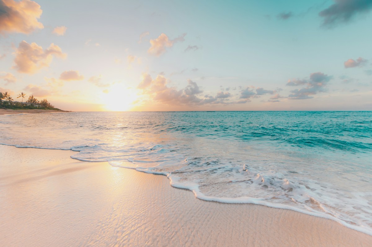 Gentle waves meeting a peaceful sandy beach